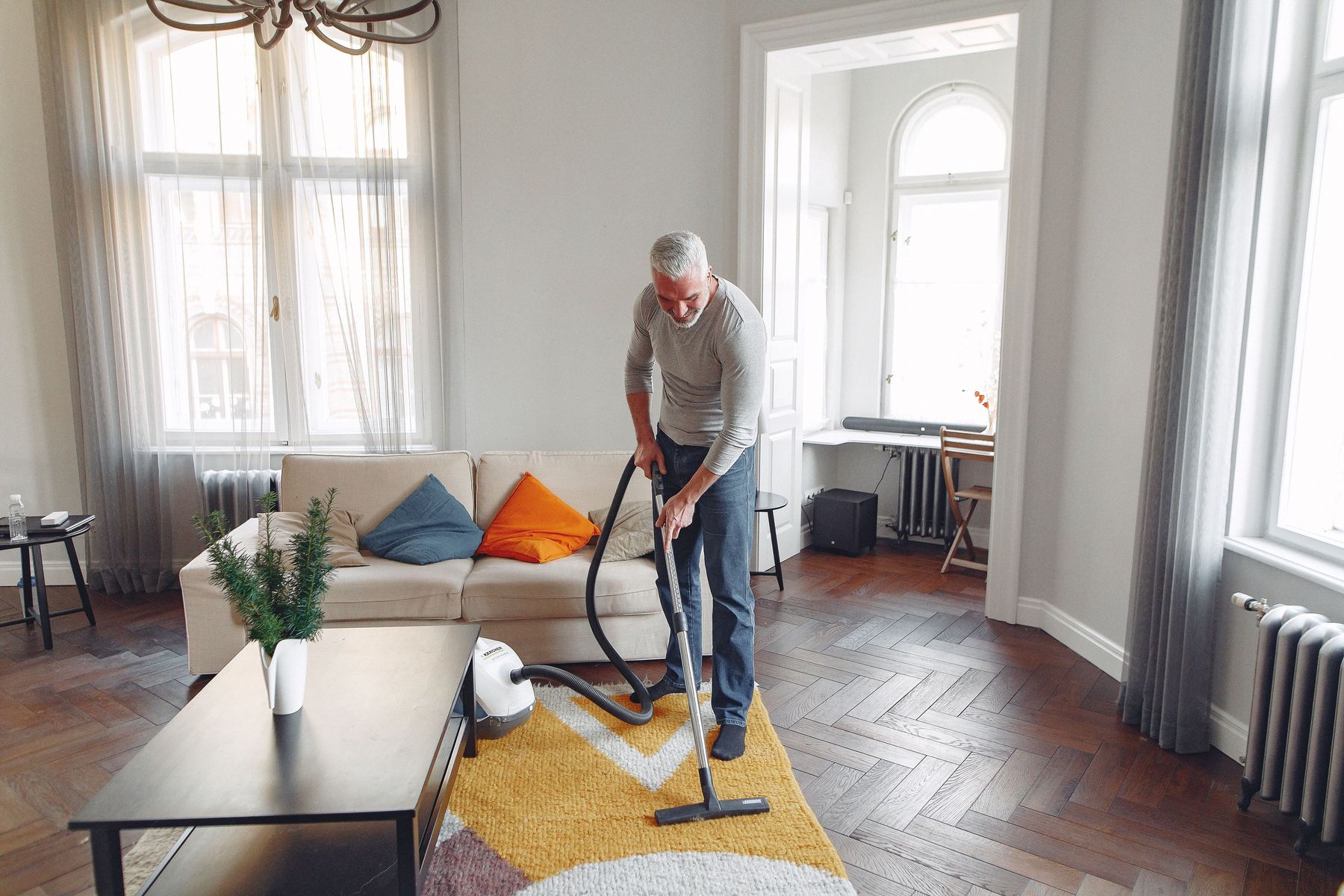 Carpet being professionally cleaned in a bright living room