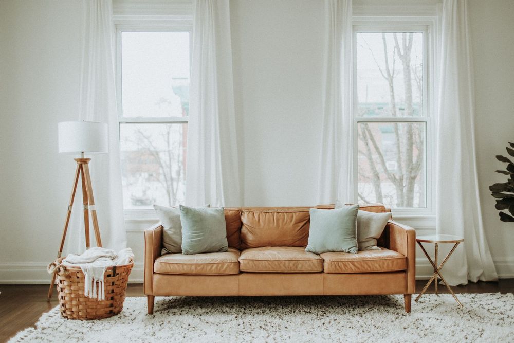A clean, bright living room with a fresh carpet