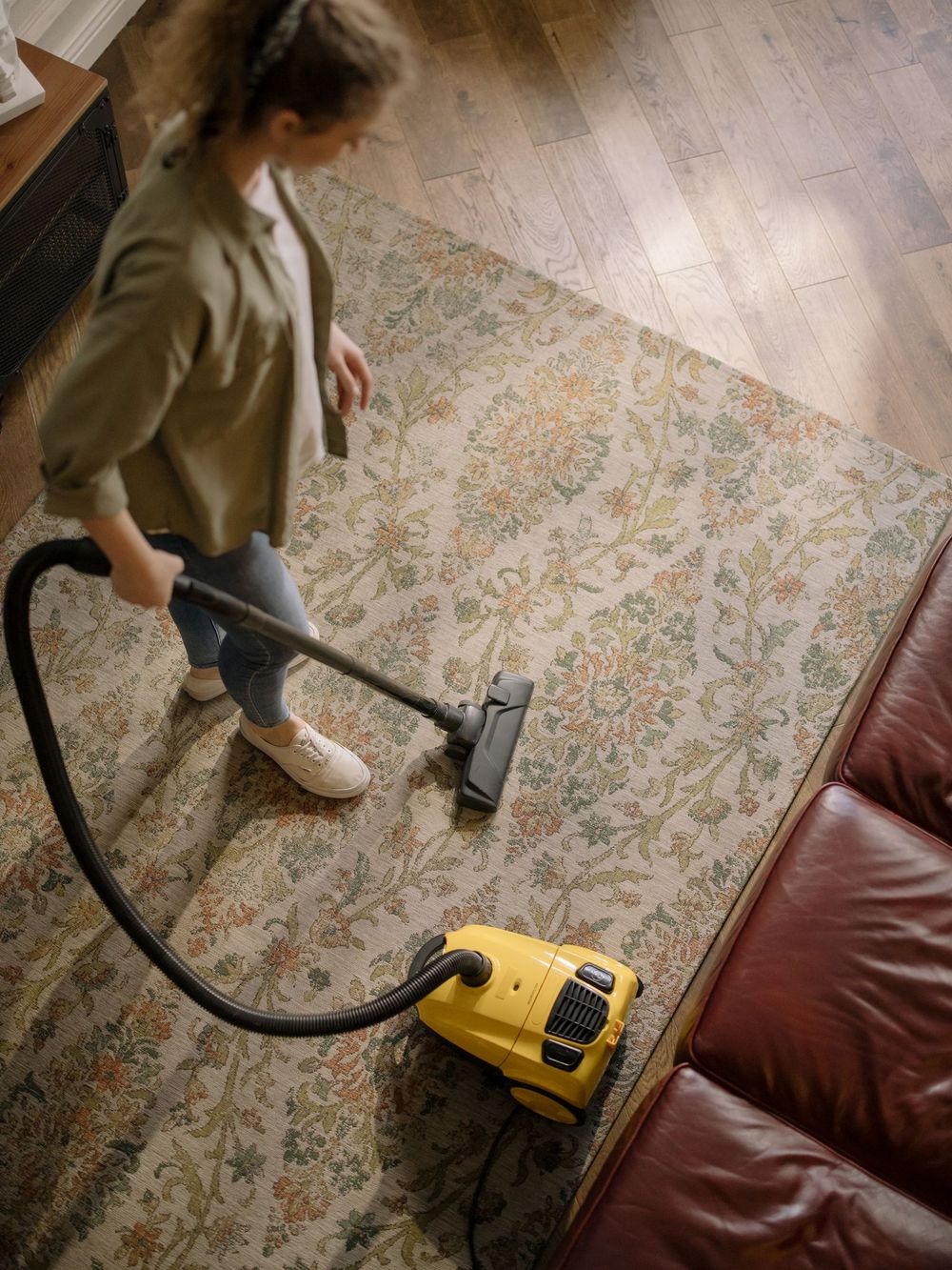 Machine cleaning a rug in a home